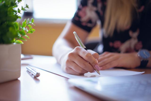 person%20using%20a%20pen%20to%20write%20out%20a%20schedule%20at%20their%20desk